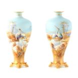 WILLIAM POWELL A FINE PAIR OF ROYAL WORCESTER CABINET VASES the inverted baluster bodies on ivory
