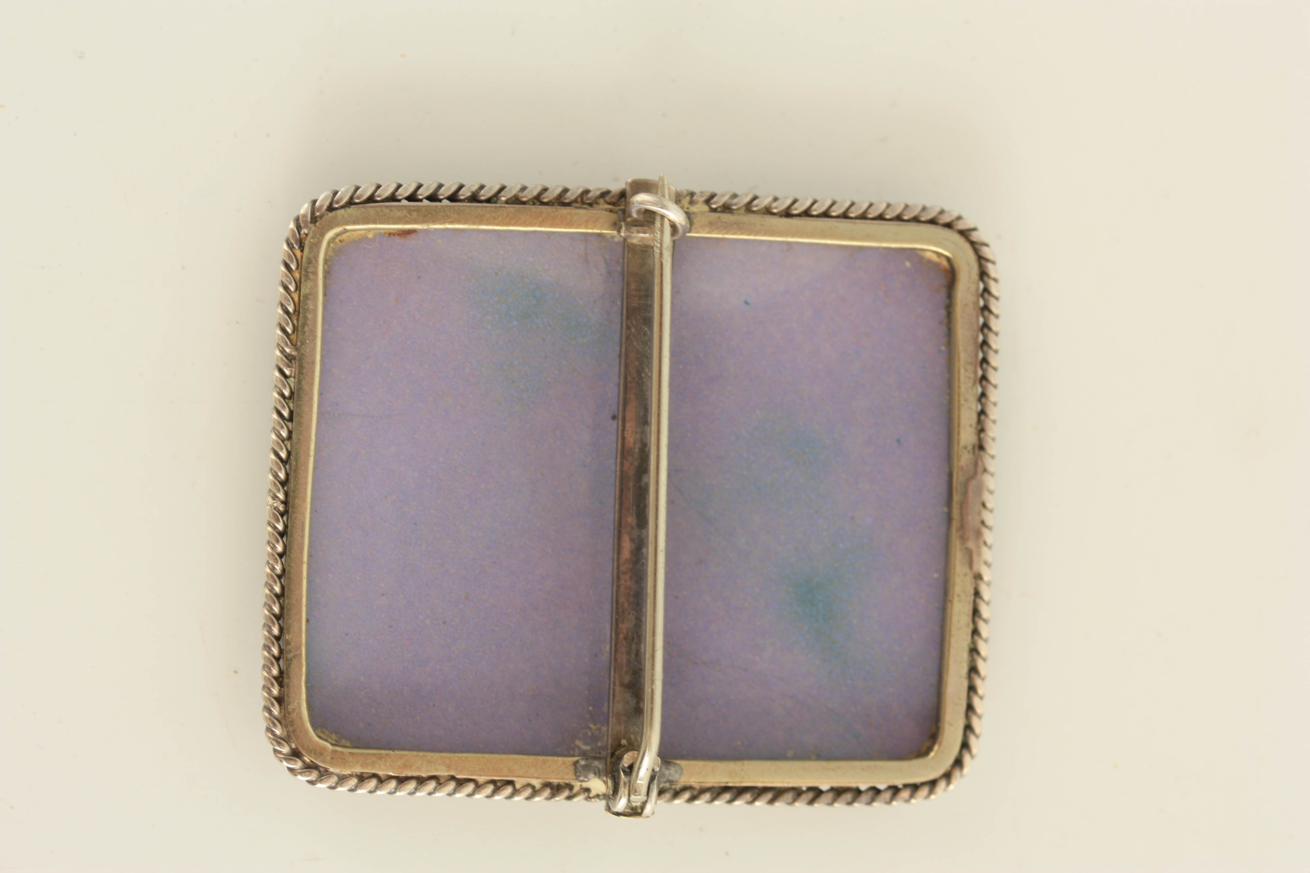 AN ENAMEL AND SILVER MOUNTED RECTANGULAR BROOCH depicting a half length portrait of a young lady 4. - Image 6 of 6