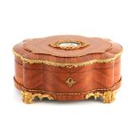 A FINE 19TH CENTURY ORMOLU MOUNTED KINGWOOD SHAPED JEWELLERY BOX with Sevres style plaque to the