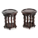 A PAIR OF LATE 19TH/EARLY 20TH CENTURY CHINESE HARDWOOD SMALL VASE STANDS with ring turned tops