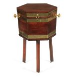 A GEORGE III MAHOGANY BRASS BOUND HEXAGONAL SHAPED CELLARETTE ON STAND with hinged top revealing a