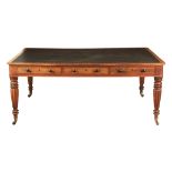 A LATE REGENCY FLAME MAHOGANY LIBRARY TABLE with leather top having crossbanded edge above three