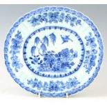 AN 18TH CENTURY CHINESE PORCELAIN BLUE AND WHITE OVAL SHAPED DISH with scalloped sides, decorated