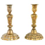 A PAIR OF 19TH CENTURY FRENCH GILT OROMLU ROCOCO STYLE CANDLESTICKS OF LARGE SIZE with step-shaped