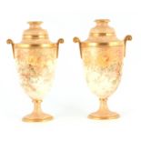 A PAIR OF LATE 19TH CENTURY DOULTON BURSLEM PEDESTAL VASES decorated with gilt piped floral