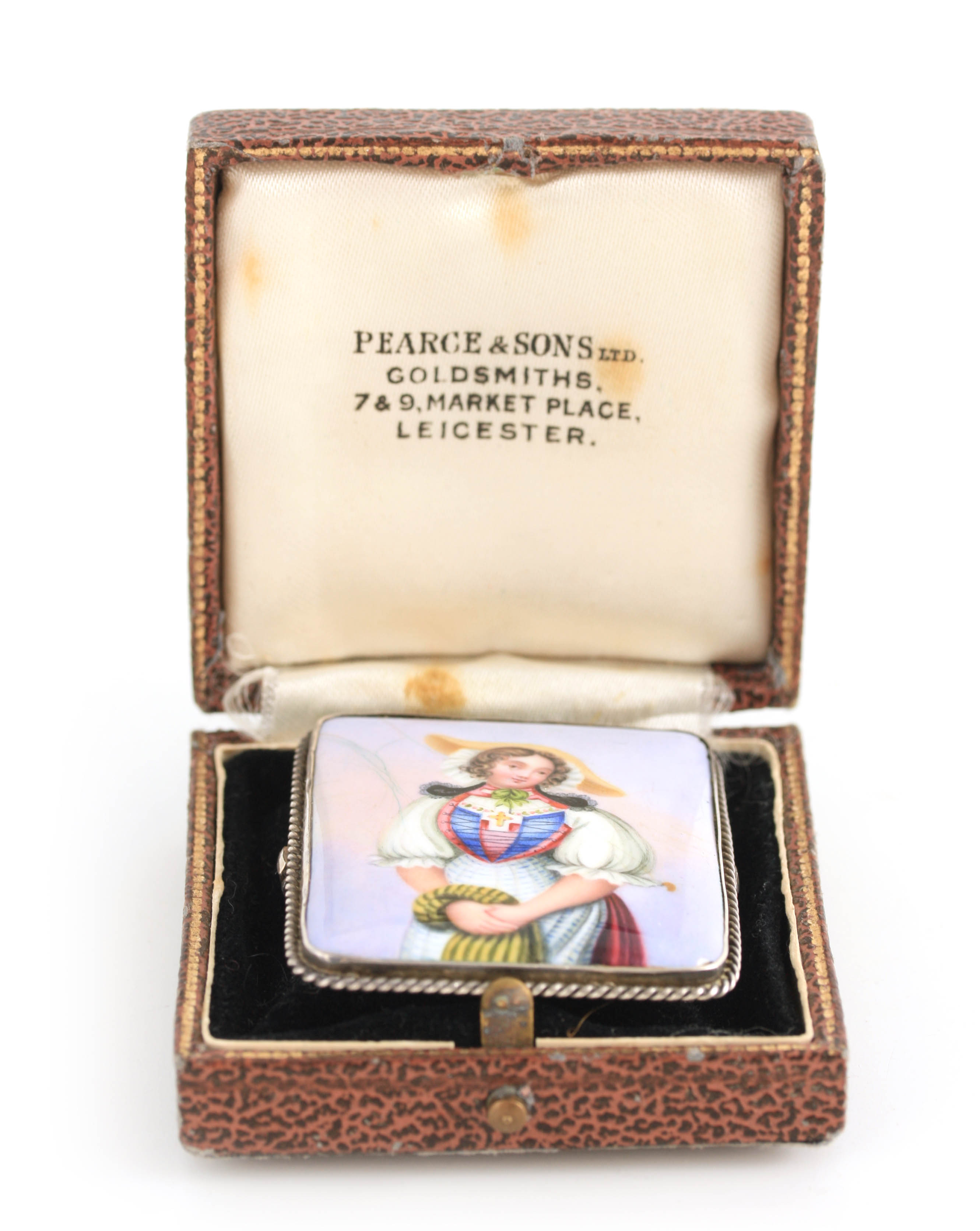 AN ENAMEL AND SILVER MOUNTED RECTANGULAR BROOCH depicting a half length portrait of a young lady 4.