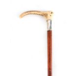 A 19TH CENTURY RIDING CROP BY BRIGG with antler horn handle above a silver collar initialled G.A.