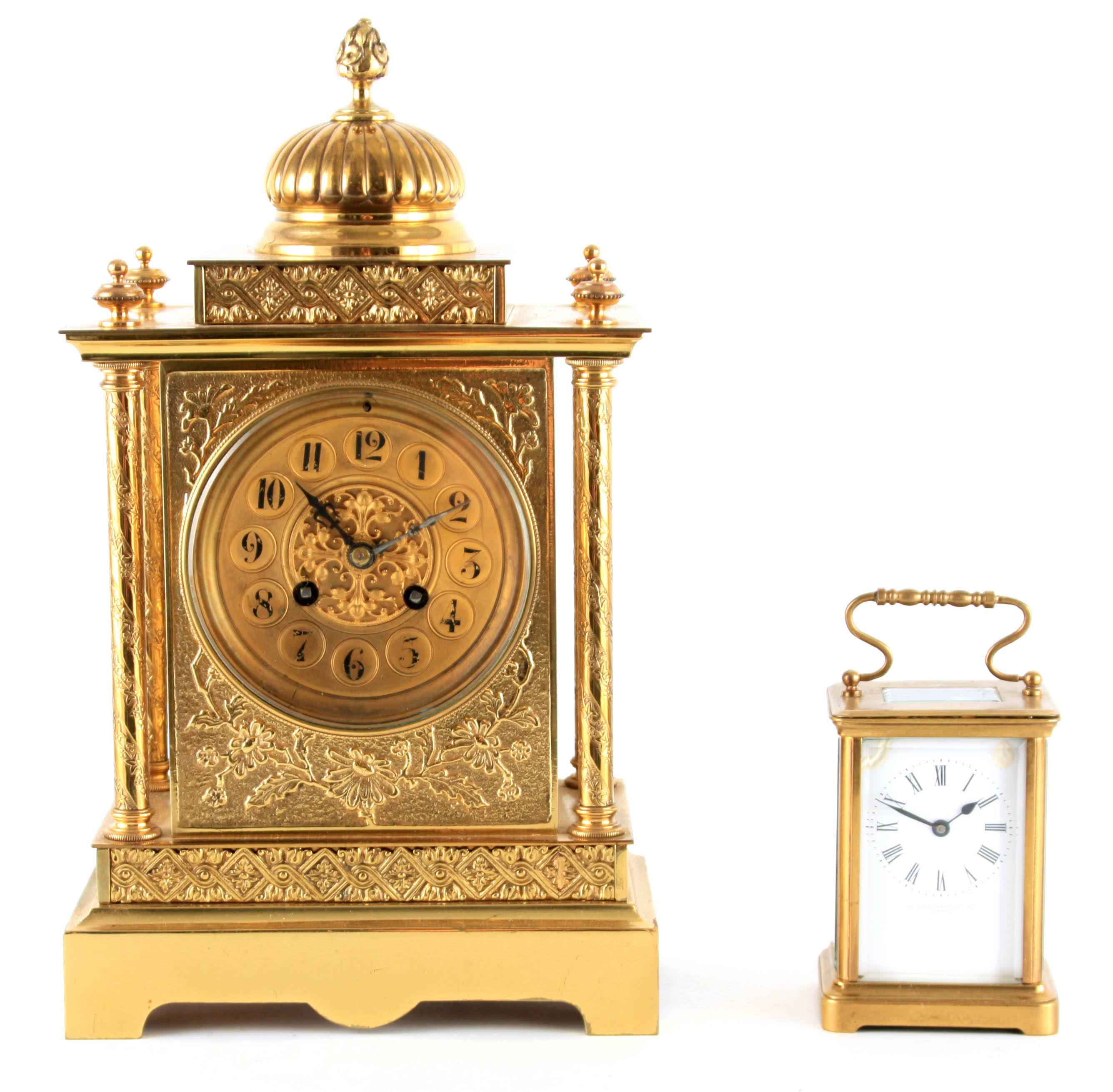 A LATE 19TH CENTURY FRENCH BRASS CASED MANTEL CLOCK having a domed top pediment above a floral