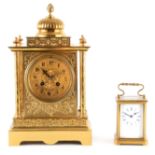 A LATE 19TH CENTURY FRENCH BRASS CASED MANTEL CLOCK having a domed top pediment above a floral
