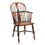 A 19TH CENTURY YEW-WOOD WINDSOR ARMCHAIR the hooped back with pierced splat and unusual ring