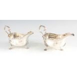 A PAIR OF GEORGE III SILVER SAUCEBOATS with raised gadrooned rims, shaped acanthus leaf handles