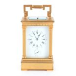 A LATE 19TH CENTURY FRENCH REPEATING CARRIAGE CLOCK WITH ALARM the gilt brass case with hinged