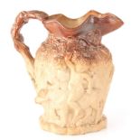A 19TH CENTURY LARGE RELIEF MOULDED STONEWARE HARVEST JUG of ornate design with double-sided