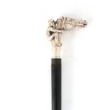 AN EARLY 20TH CENTURY SILVER TOPPED WALKING STICK OF EQUESTRIAN INTEREST having a cast silver handle