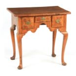 AN EARLY 18TH CENTURY CROSS-BANDED INLAID FIGURED WALNUT LOWBOY with quarter veneered top above an
