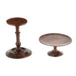 A 19TH CENTURY MAHOGANY CANDLESTAND with turned stem and wide base 23.5cm high TOGETHER WITH A