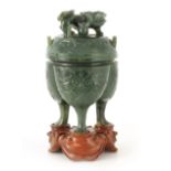 A CHINESE SPINAGE GREEN JADE KORO AND COVER of triple panelled two-handled form with dog of fo