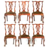 A FINE SET OF SIX GEORGE II WALNUT SIDE CHAIRS IN THE MANNER OF GILES GRENDEY the elaborate scrolled