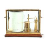 SHORT & MASON, LONDON AN EARLY 20TH CENTURY BRASS AND OAK CASED MICRO-BAROGRAPH the brass glazed