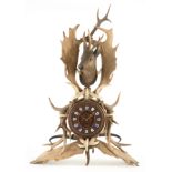 A LARGE LATE 19TH CENTURY BLACK FOREST HUNTERS TROPHY CLOCK the case formed out of roe antler,