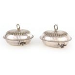 A PAIR OF 19TH CENTURY SILVER PLATE MUFFIN DISHES WITH HOT WATER WARMING BASES having domed