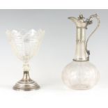 A 19TH CENTURY ENGRAVED BULBOUS GLASS CLARET JUG with slender neck and engraved silvered metal