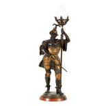 A 19TH CENTURY GILT METAL FIGURAL TABLE LAMP formed as a knight in armour, having a torch shaped