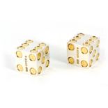 A CASED PAIR OF SOLID SILVER AND SILVER GILT BULGARI DICE engraved to one side 'BULGARI, MELBOURN'