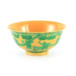 A CHINESE YELLOW GROUND FOOTED BOWL with raised green overglaze figure and landscape decoration 14.