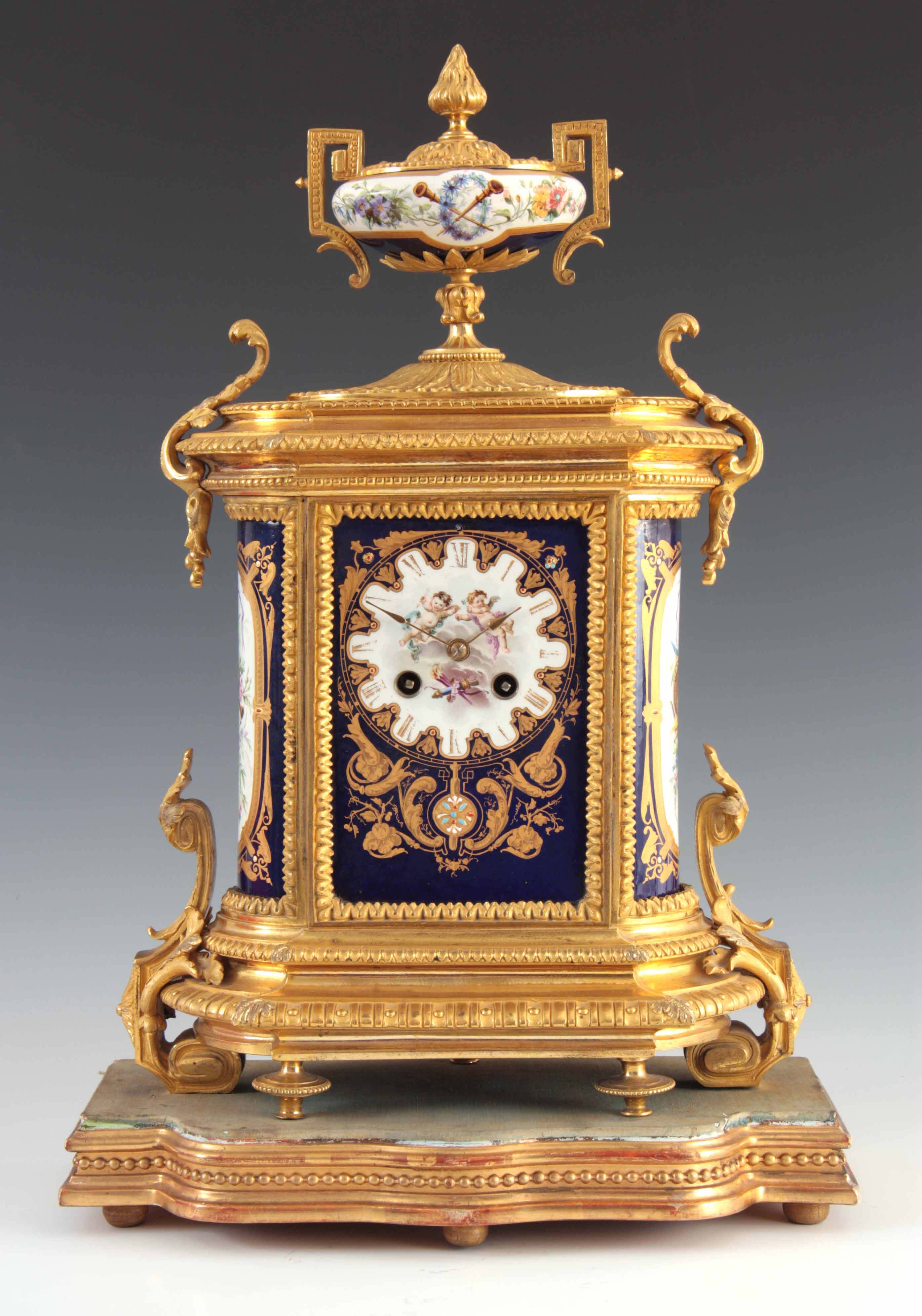 A LATE 19TH CENTURY FRENCH ORMOLU AND PORCELAIN PANEL MANTEL CLOCK the gilt brass case with chased