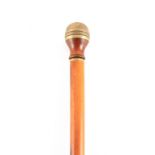 A 19TH CENTURY MALACCA CANE WALKING STICK WITH FITTED COMPASS the turned walnut and brass finial