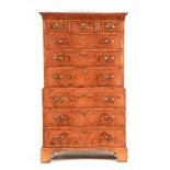 A 18TH CENTURY CROSSBANDED AND HERRINGBONE STRUNG FIGURED WALNUT CHEST ON CHEST with moulded cornice