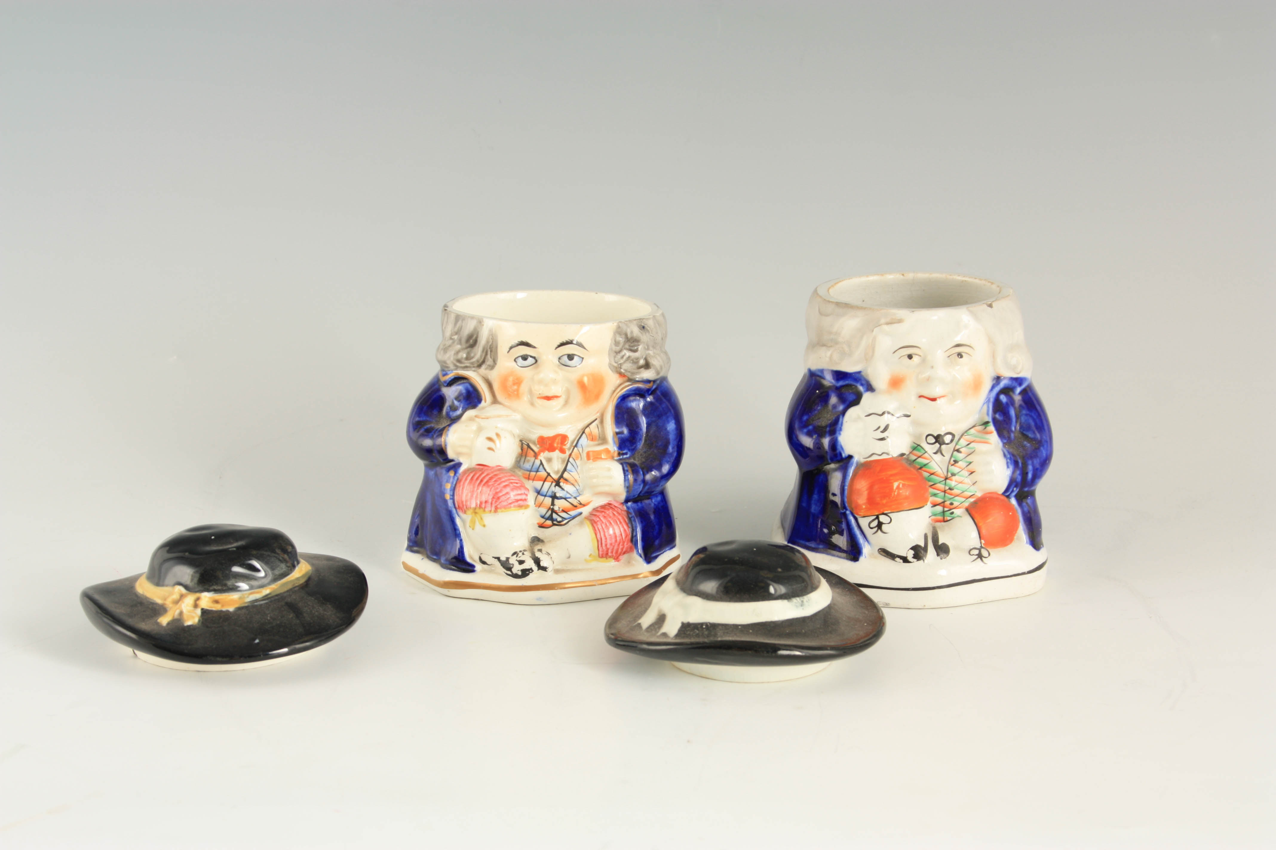 A PAIR OF COLOURFUL SEATED TOBY FIGURE LIDDED JARS 12.5cm high - Image 3 of 4