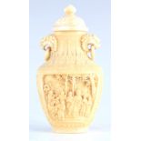 A CHINESE CHIEN LUNG IVORY SNUFF BOTTLE of oval form with lions mask and ring side handles above a