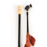 A LATE 19TH CENTURY FRENCH IVORY HANDLED WALKING STICK with ebonised shaft and carved bust handle of