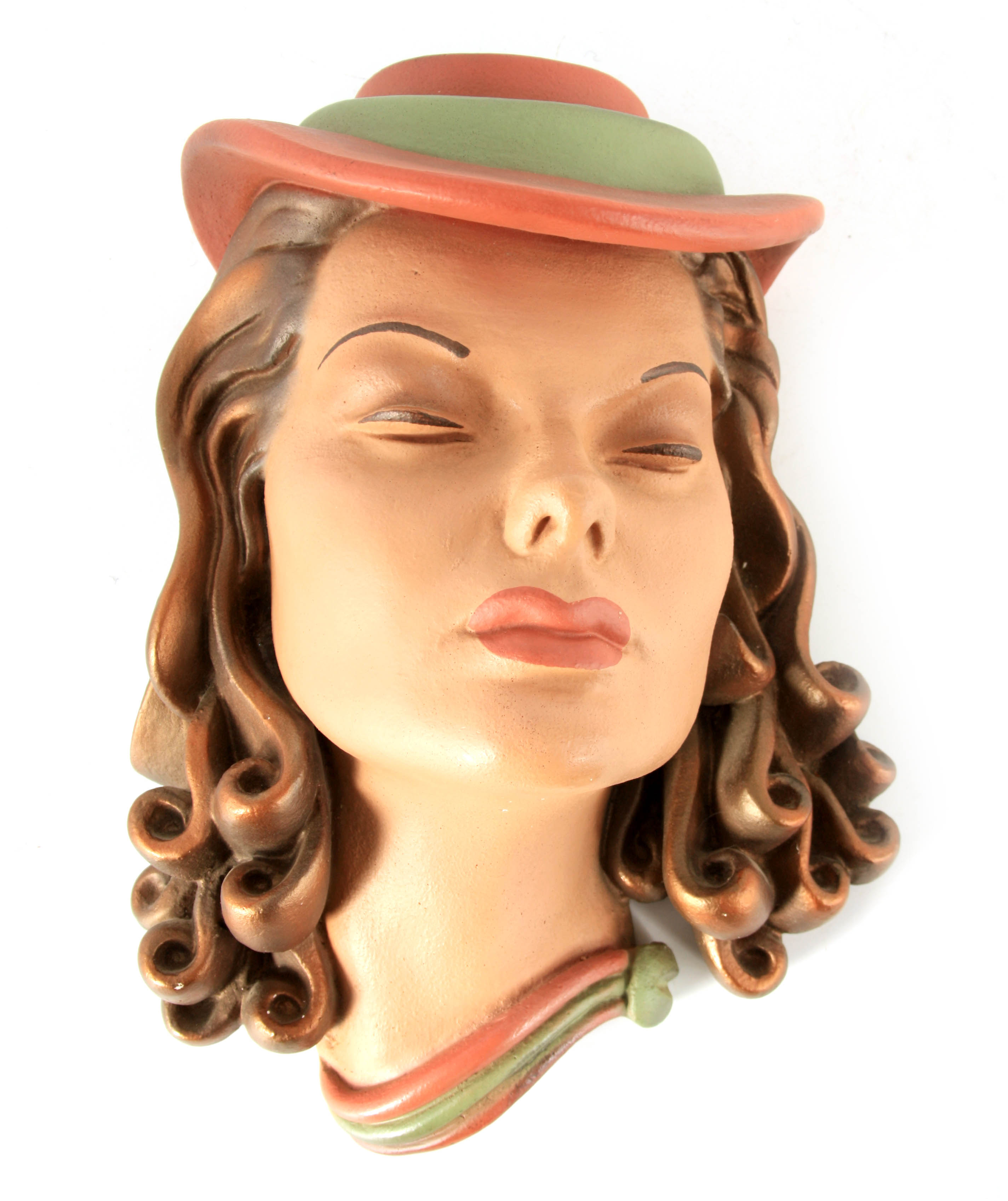 AN ART DECO STYLE POTTERY WALL MASK of a stylised young lady wearing a hat 33cm high