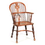 A 19TH CENTURY NOTTINGHAMSHIRE ASH AND FRUITWOOD WINDSOR ARMCHAIR with shaped fret cut "christmas