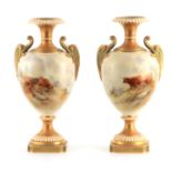 JOHN STINTON, A FINE PAIR OF ROYAL WORCESTER IVORY, GILT AND GREEN TINGED OVOID PEDESTAL CABINET