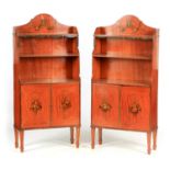 A PAIR OF LATE 19TH CENTURY SHERATON STYLE PAINTED SATINWOOD WATERFALL BOOKCASES with shaped tops