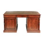 A LATE GOERGE III MAHOGANY PARTNERS DESK having a green leather writing surface with gilt border