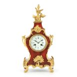 A LATE 19TH CENTURY FRENCH TORTOISESHELL AND ORMOLU MOUNTED MANTEL CLOCK the shaped case having