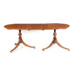 A REGENCY STYLE MAHOGANY TWIN PEDESTAL D END DINING TABLE the reed-edge top with an optional