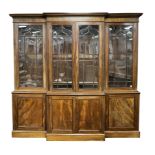 A 19TH CENTURY MAHOGANY BREAKFRONT LIBRARY BOOKCASE with moulded cornice above astragal glazed doors
