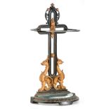 A 19TH CENTURY CAST IRON STICK STAND with gilt painted griffins to the back and D shaped base,