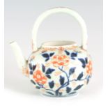 AN 18TH CENTURY CHINESE PORCELAIN TEAPOT decorated with flowering blossom on a bulbous body and