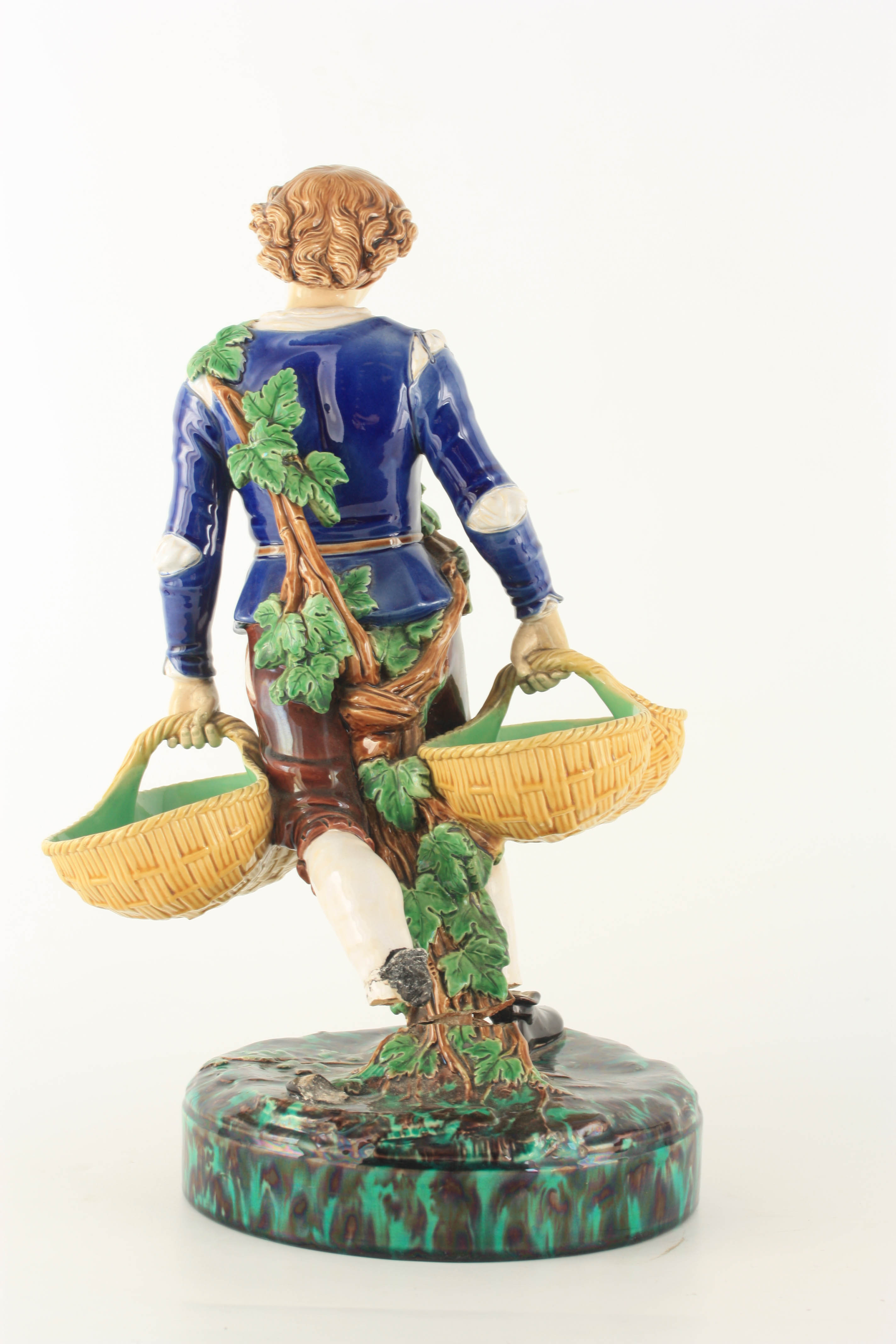 A 19TH CENTURY MINTON MAJOLICA FIGURE finely modelled as a young man carrying baskets coloured in - Image 6 of 8