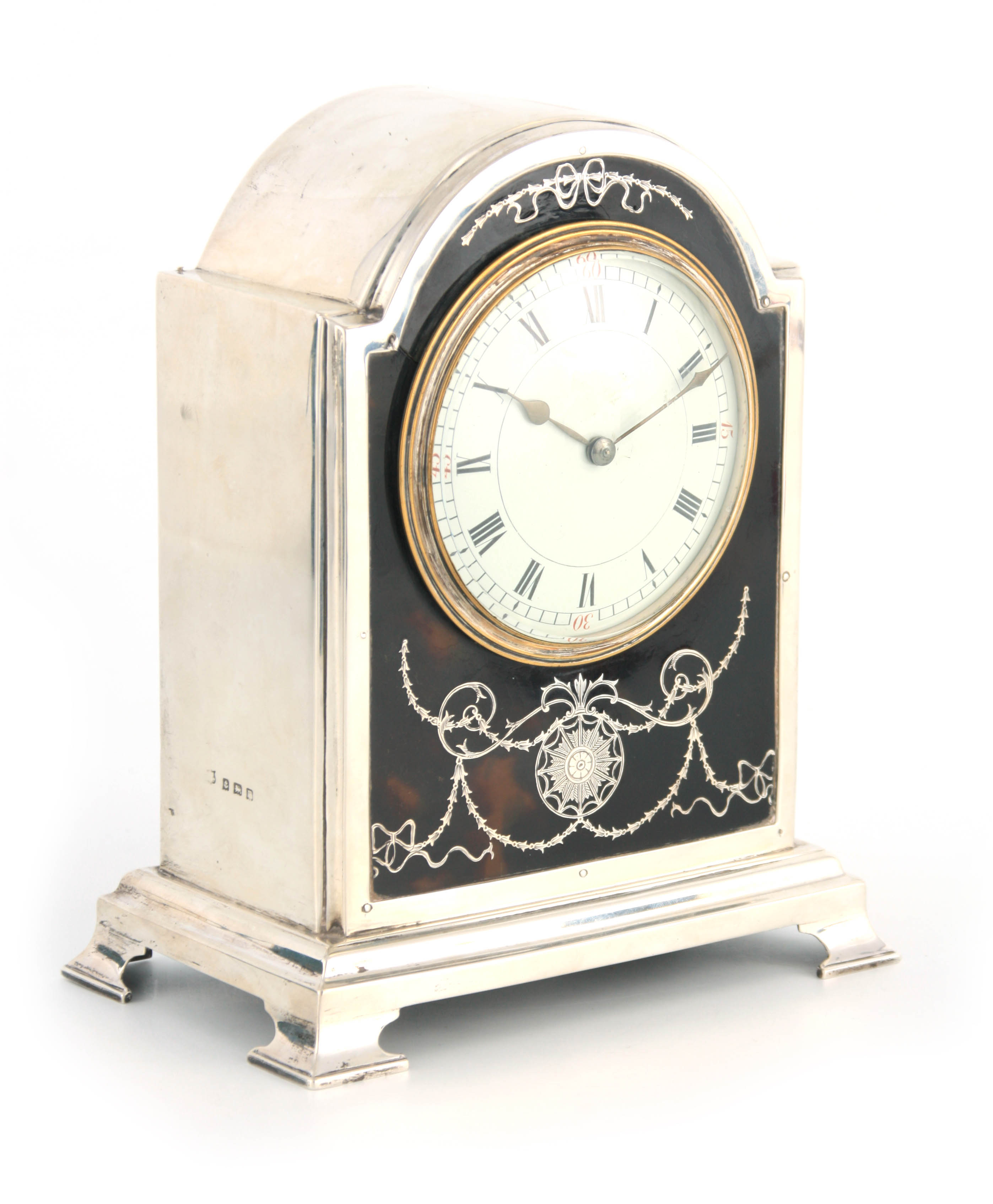 A GOOD EDWARDIAN SILVER AND TORTOISESHELL MANTEL CLOCK the arch-shaped case with Adam-style inlaid