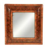 A WILLIAM & MARY OYSTERED LABURNUM CUSHION FRAMED MIRROR with short-grained mouldings and central