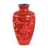 A CHINESE CINNABAR ON BLUE ENAMEL SHOULDERED TAPERING VASE with all-round decoration in high
