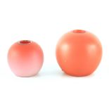 TWO GRADUATED BURMESE APRICOT AND SHADED GROUND GLOBULAR MATCH HOLDERS 10.5cm and 8cm high